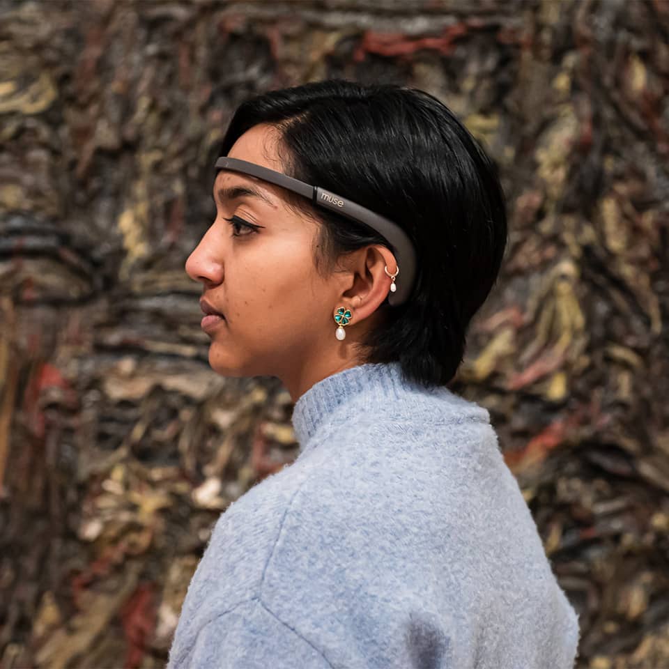 Woman wearing Muse headband on her head