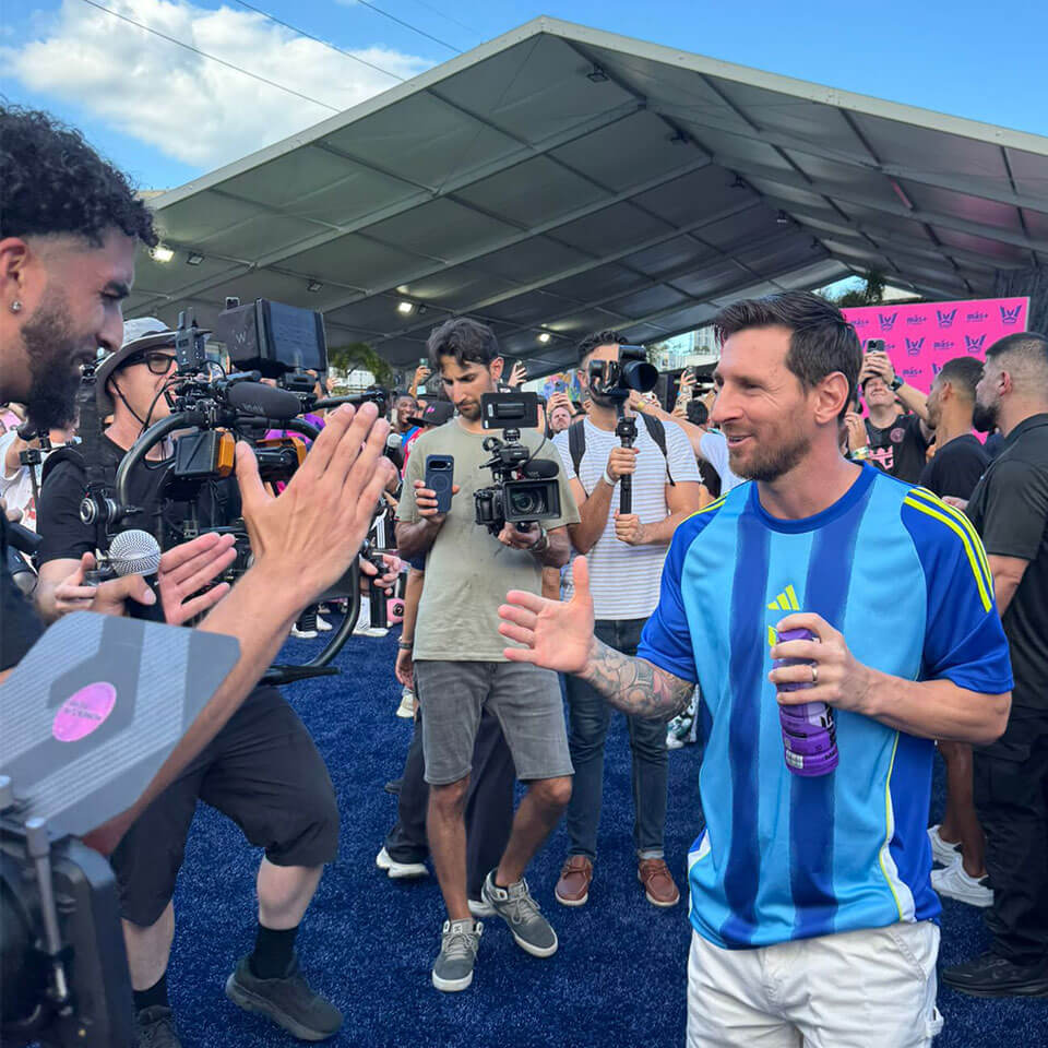 Lionel Messi with a crowd of people
