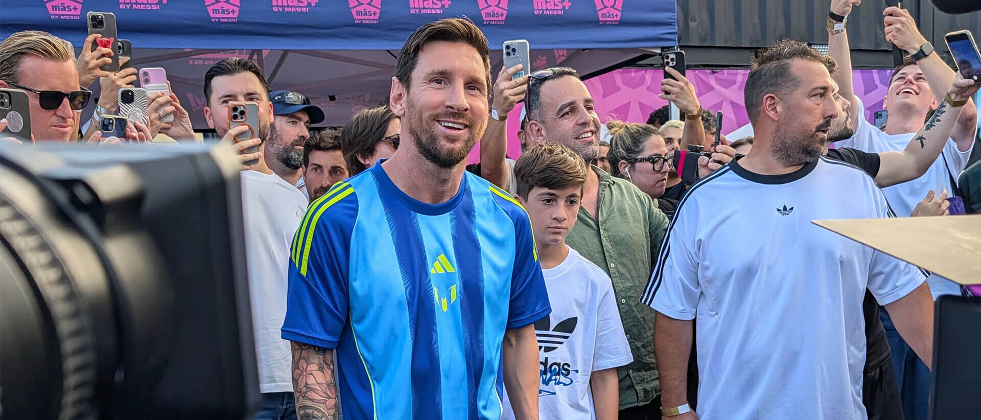 Lionel Messi with a crowd of people