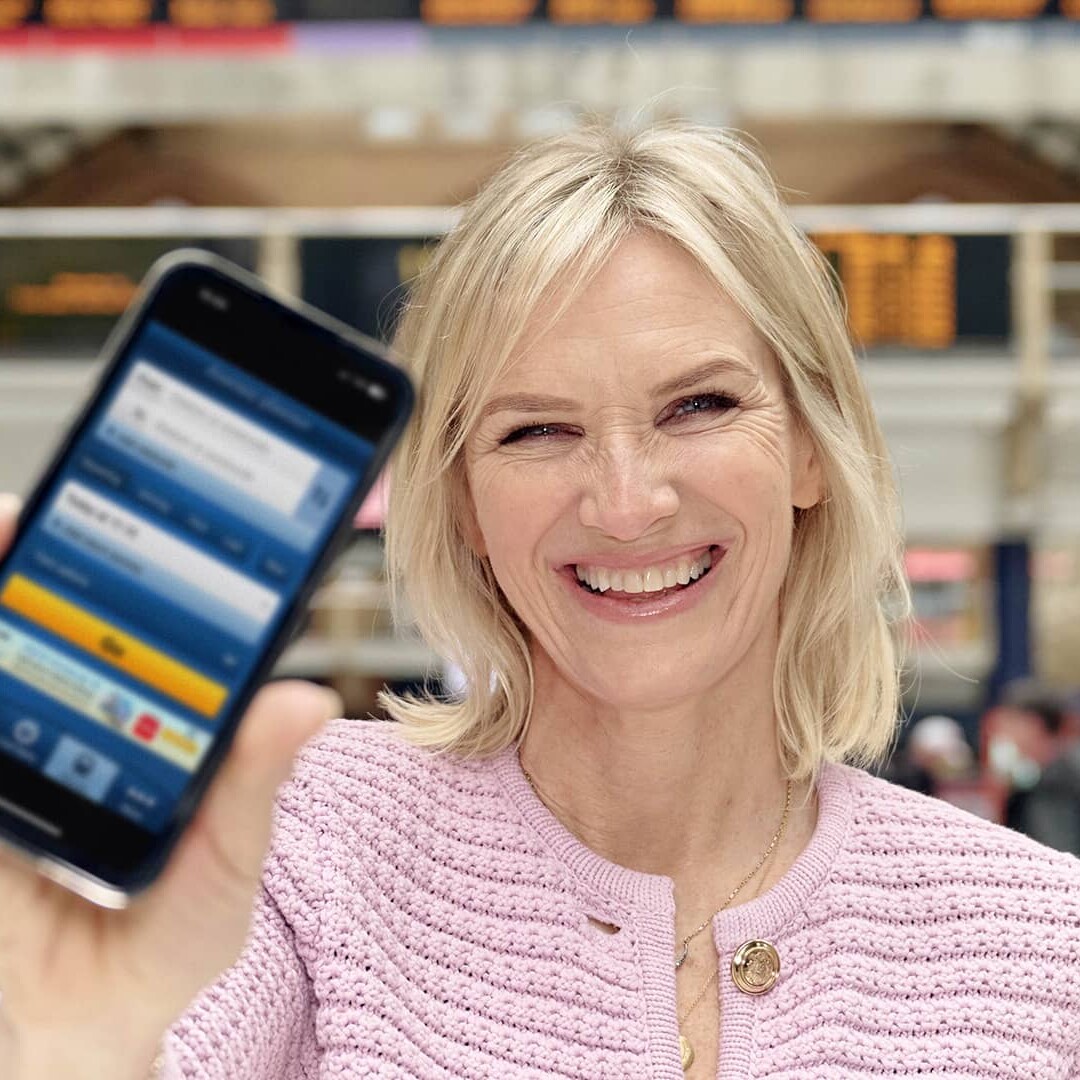 Woman holding a mobile phone with app