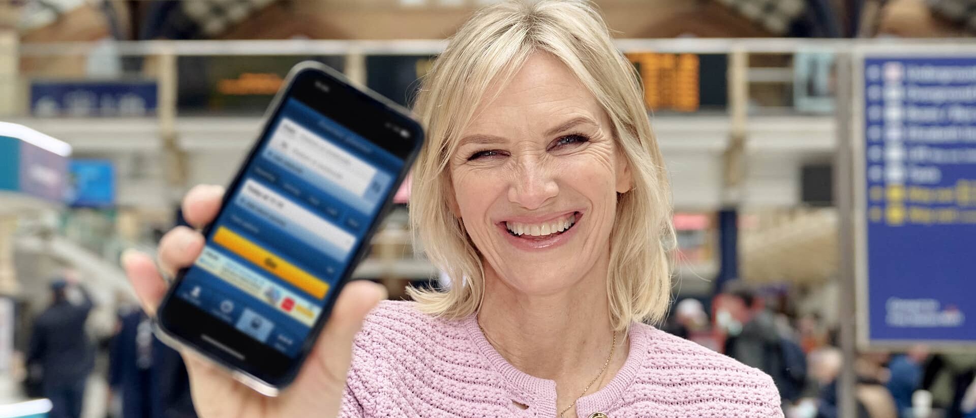 Woman holding a mobile phone with app