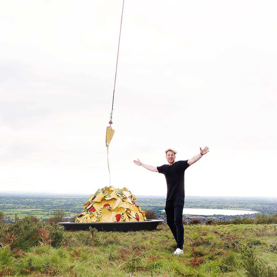 Man staying on a plate with nachos