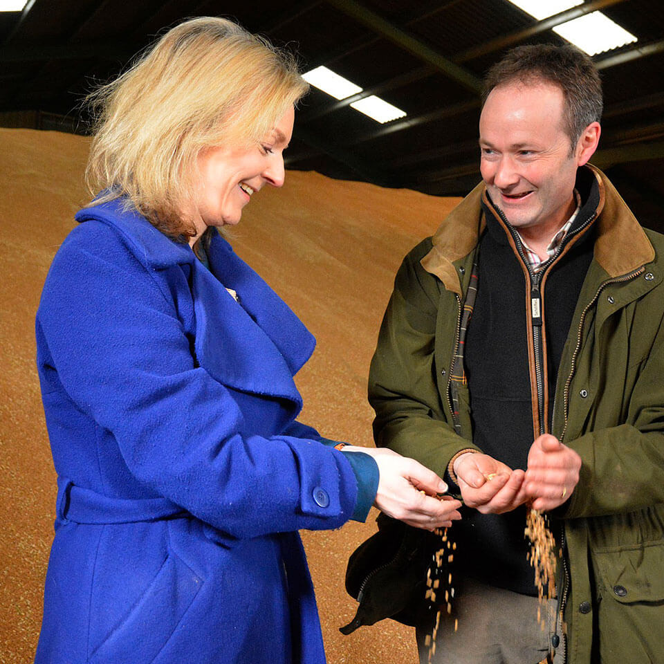 Two people with grain