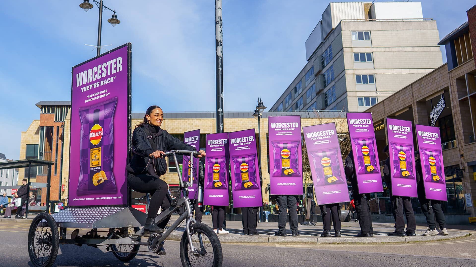Group of people promoting Walkers chips