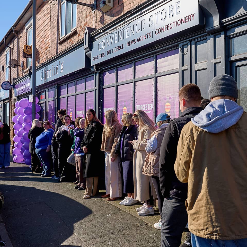 Queue of people staying in front of store